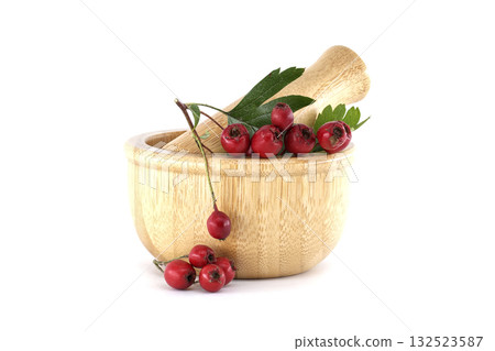 Hawthorn Berries and Leaves in a Wooden Mortar 132523587