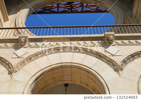 Historic stone arches with ornate details 132524003