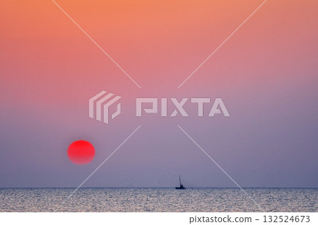 Sun rising over Toyama Bay in Harukasumi and fishing boats Sun rising over Toyama Bay in Harukasumi and fishing boats 132524673