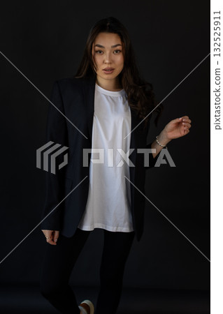Editorial style image capturing clothing textures with poised model and gentle illumination Editorial style image capturing clothing textures with poised model and gentle illumination 132525911
