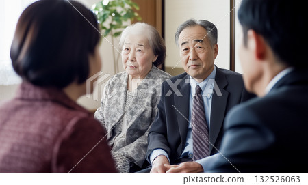 An awkward elderly couple facing each other with serious expressions 132526063