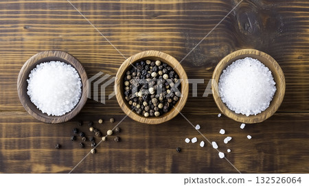 Aerial view of granular salt and pepper on a plate 132526064