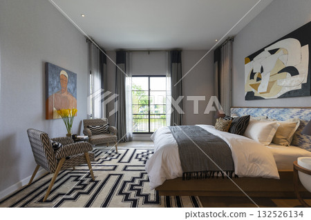 Stylish pale green and white bedroom in the master suite. Stylish pale green and white bedroom in the master suite. 132526134