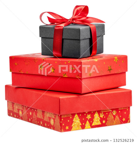 Stack of red and black gift boxes decorated with gold Christmas patterns and red ribbon, isolated on white background. Holiday composition symbolizing celebration, surprise, and festive spirit Stack of red and black gift boxes decorated with gold Christmas patterns and red ribbon, isolated on white background. Holiday composition symbolizing celebration, surprise, and festive spirit 132526219