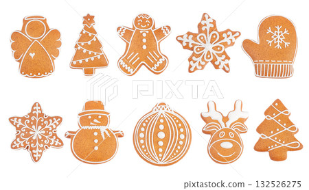 Collection of festive gingerbread cookies in various Christmas shapes with white icing on white background, top view symbolizing holiday baking and winter traditions. Collection of festive gingerbread cookies in various Christmas shapes with white icing on white background, top view symbolizing holiday baking and winter traditions. 132526275