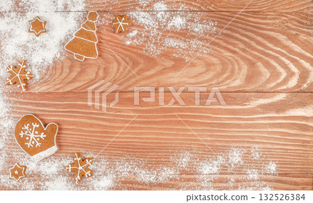 Christmas cookies and powdered sugar on a wooden table background with empty copy space for festive text or holiday design. top view 132526384