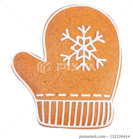Gingerbread mitten cookie decorated with white icing snowflake pattern isolated on white background Gingerbread mitten cookie decorated with white icing snowflake pattern isolated on white background 132526414