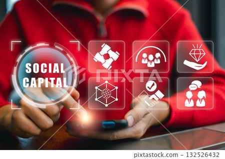 Visual representation of social capital with digital icons and smartphone, highlighting networking and community connections. Visual representation of social capital with digital icons and smartphone, highlighting networking and community connections. 132526432