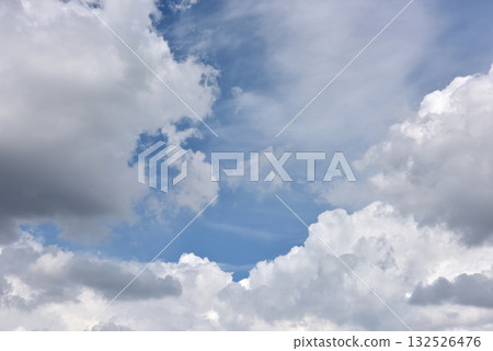 Vivid white cumulonimbus clouds spreading across the blue sky Vivid white cumulonimbus clouds spreading across the blue sky 132526476