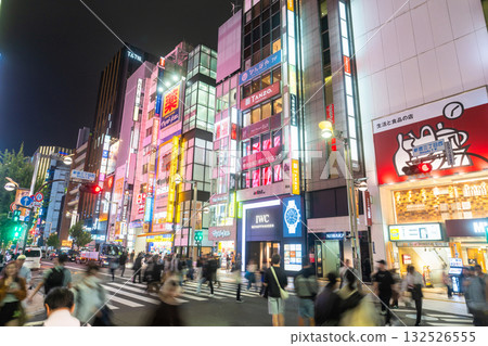 Tokyo: Shinjuku East Exit, a bustling shopping district lit by neon lights 132526555