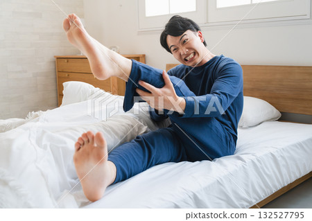 A young man with a cramp Lifestyle image A young man with a cramp Lifestyle image 132527795