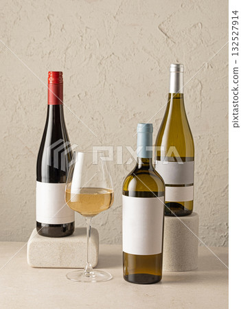 various wine bottles and glass of white wine various wine bottles and glass of white wine 132527914