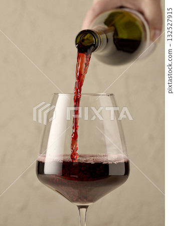 red wine pouring in glass red wine pouring in glass 132527915