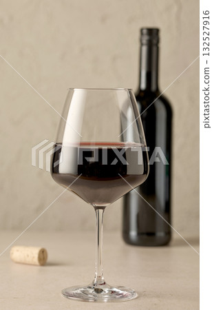 closeup of red wine glass and bottle closeup of red wine glass and bottle 132527916