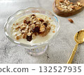 Yogurt topped with nuts and dried fruits. A healthy and nutritious breakfast. 132527935