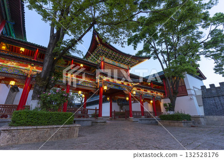 Lijiang, China - April 10, 2024 : Beautiful image of Mufu Palace in Lijiang old town at evening light in Lijiang, China on April 10, 2024. Lijiang, China - April 10, 2024 : Beautiful image of Mufu Palace in Lijiang old town at evening light in Lijiang, China on April 10, 2024. 132528176