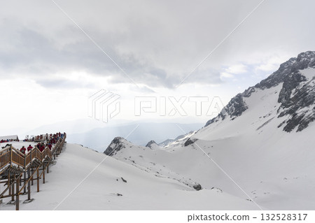 Lijiang, China - April 10, 2024 : Crowd of tourist sightseeing on Jade dragon snow mountain in Lijiang, China on April 10, 2024. 132528317