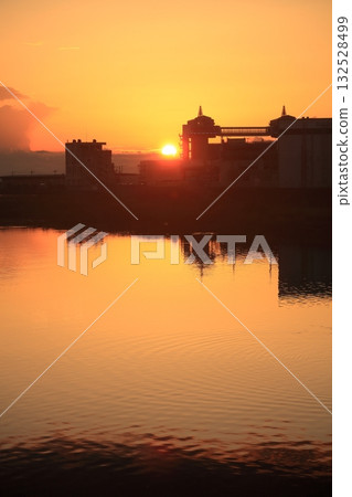 Sunset reflected on the surface of the water Sunset reflected on the surface of the water 132528499