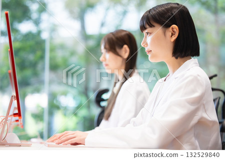 A young lady in white 132529840