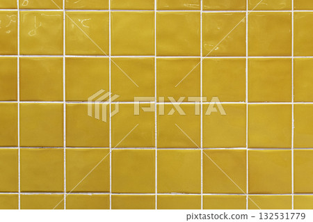 Yellow ceramic tile background. Old vintage ceramic tiles in green to decorate the kitchen or bathroom  132531779