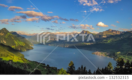 Scenic and beautiful mountain view with clouds overlooking Lake Luzerne (locally known as Vierwaldsttersee). 132532315