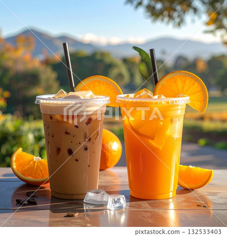 A glass of cold orange juice with ice A glass of cold orange juice with ice 132533403