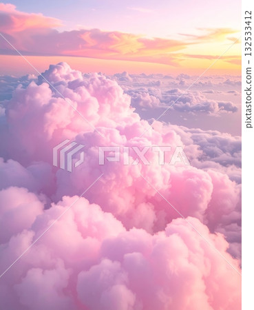 Fluffy white cumulus clouds drift lazily across a brilliant blue sky, a perfect, serene summer day 132533412