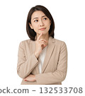 A young businesswoman thinking (realistic) 132533708
