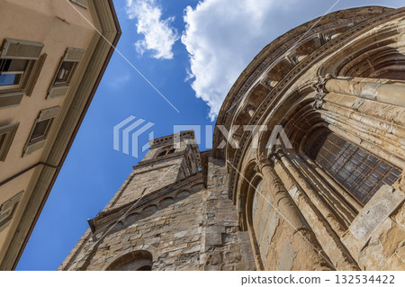 Low angle view of Saint Mary Major Basilica showing bell tower, apse, Romanesque arches and columns 132534422