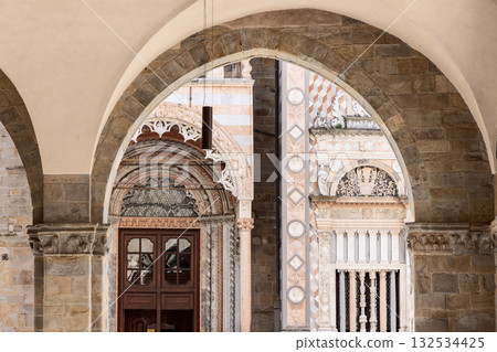 Renaissance detail of Colleoni Chapel seen through Palazzo della Ragione arches in Bergamo Renaissance detail of Colleoni Chapel seen through Palazzo della Ragione arches in Bergamo 132534425