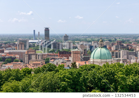 Panoramic view of Brescia with Duomo Nuovo green dome framed by trees and modern buildings Panoramic view of Brescia with Duomo Nuovo green dome framed by trees and modern buildings 132534453