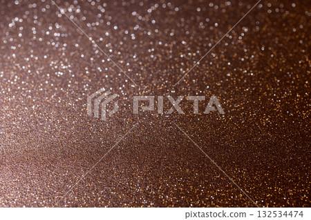 Macro bronze glitter texture in focus below with soft blurred depth above Macro bronze glitter texture in focus below with soft blurred depth above 132534474