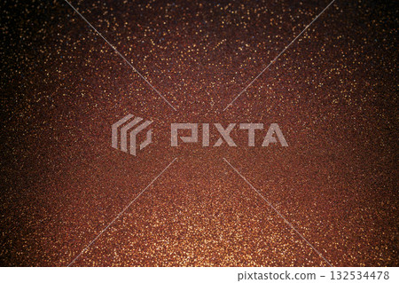 Brown glitter surface illuminated from bottom with rising sparkles creating gradient elegance 132534478