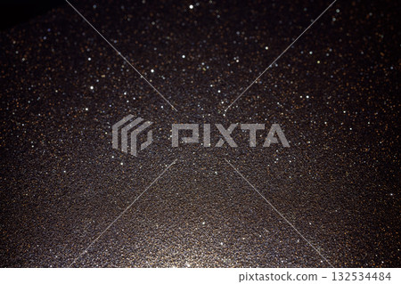 Dark glitter texture illuminated from below with surface detail and rare subtle sparkles Dark glitter texture illuminated from below with surface detail and rare subtle sparkles 132534484
