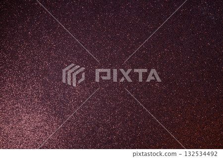 Radiant abstract burgundy glitter with evenly focused surface and soft lower left illumination Radiant abstract burgundy glitter with evenly focused surface and soft lower left illumination 132534492