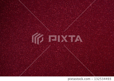 Bright burgundy glitter texture with granular relief and countless sparkles in macro 132534493