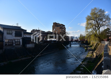 Takayama City, Gifu Prefecture, Japan - During the Takayama Spring Festival, the tourist attraction Nakabashi Bridge and the surrounding townscape, beautiful blue sky and willow trees 132535066