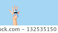 Men's health and Prostate cancer awareness campaign in November. Man hands holding light blue ribbon awareness with mustache on blue background. Symbol for support men who living with cancer. 132535150