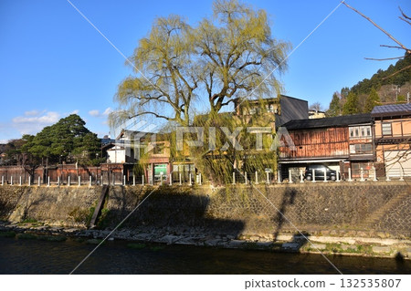 Takayama City, Gifu Prefecture, Japan - During the Takayama Spring Festival, the streets around Nakabashi Bridge, a popular tourist spot, with beautiful blue skies, old houses, and willow trees 132535807