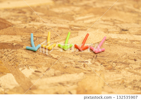 Colorful arrows on osb plywood Colorful arrows on osb plywood 132535907