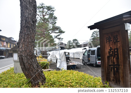 Takayama City, Gifu Prefecture, Japan: During the Spring Takayama Festival, the entrance to the Jinya Morning Market and information sign. Stalls selling local specialties. Before opening. 132537210
