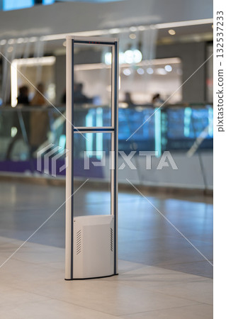 A modern, transparent security gate stands A modern, transparent security gate stands 132537233
