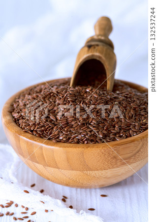 Brown Flaxseeds in Wooden Bowl. Brown Flaxseeds in Wooden Bowl. 132537244