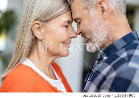 Waist up picture of man and woman face to face to each other feeling peaceful 132537905