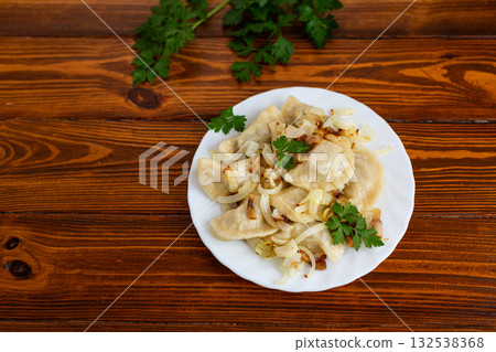 Traditional comfort food dumplings with savory onion and parsley Traditional comfort food dumplings with savory onion and parsley 132538368