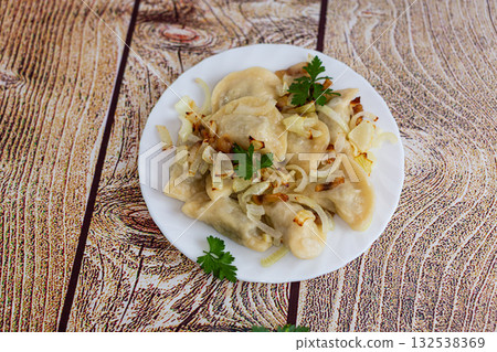 Traditional comfort food dumplings with savory onion Traditional comfort food dumplings with savory onion 132538369