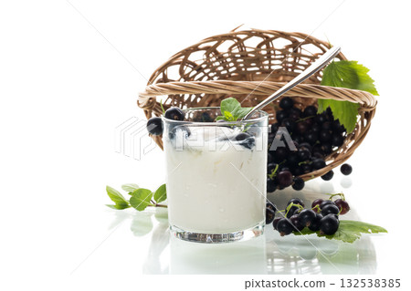 Homemade yogurt with blackcurrant berries, isolated on white background Homemade yogurt with blackcurrant berries, isolated on white background 132538385