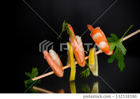 Ready to eat red shrimps with lemon isolated on black background 132538390