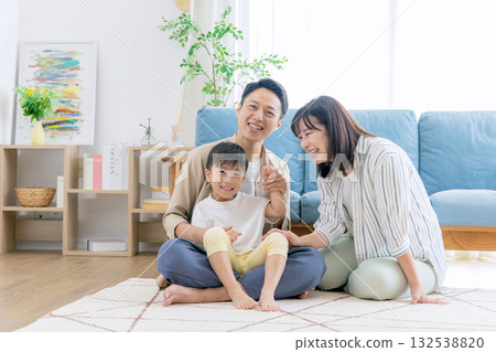A family relaxing in the living room 132538820