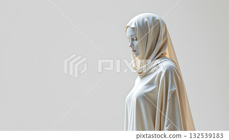 A person standing in front of a white background, wearing a hijab A person standing in front of a white background, wearing a hijab 132539183